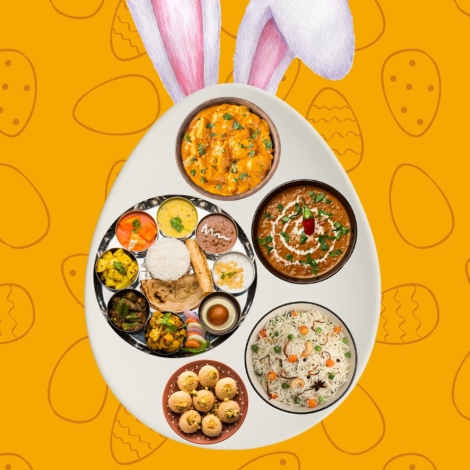 An Easter-themed image with bunny ears and a large egg-shaped plate of Indian thali, rice, and curries.